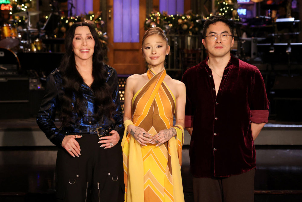 Musical guest Cher, host Ariana Grande, and Bowen Yang during SNL