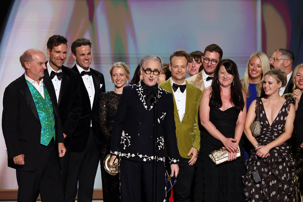 78th PRIMETIME EMMY AWARDS -- Pictured: Cast and crew including Stephen Lambert, Mike Cotton, Sam Rees-Jones, Rosie Franks and Alan Cumming accept the Outstanding Reality Competition Program Award for "The Traitors" on stage during the 78th Primetime Emmy Awards held at the Peacock Theater on September 14, 2026 -- (Photo by: Trae Patton/NBC)
